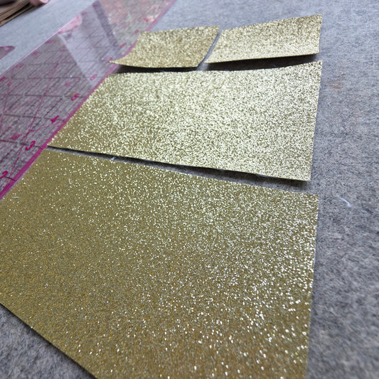 REMNANT gold glitter fabric
