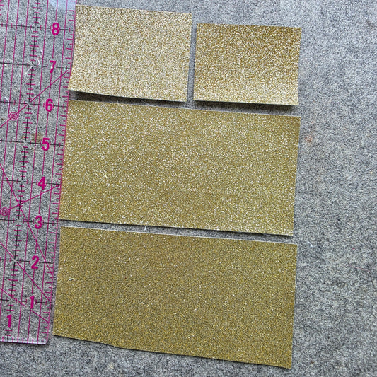 REMNANT gold glitter fabric