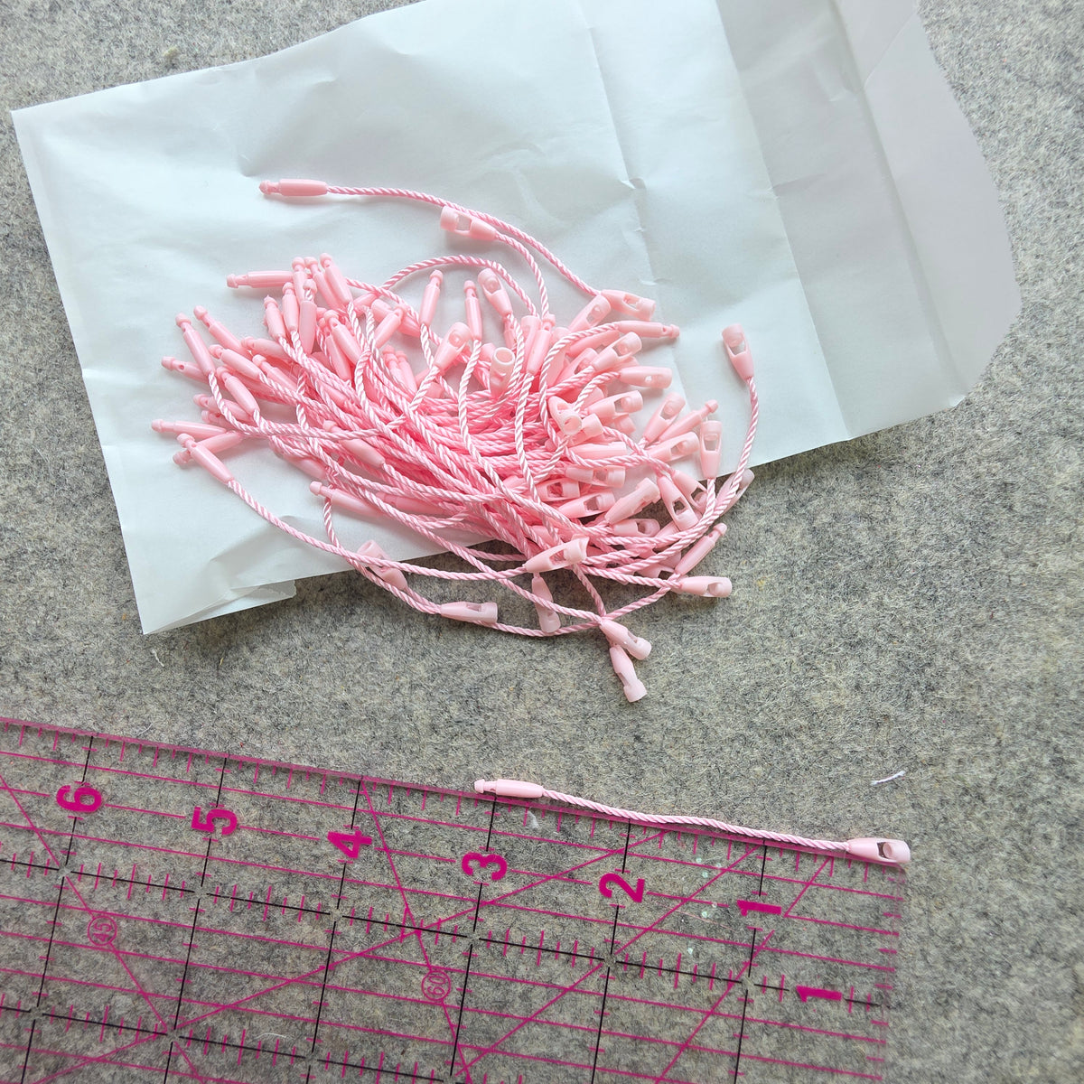 pink product tag strings