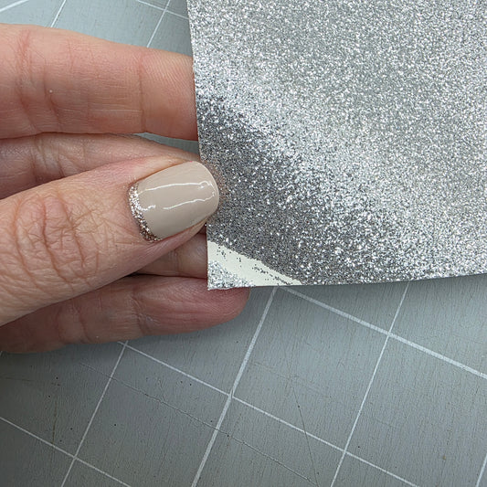 REMNANT A5 silver glitter fabric with defect